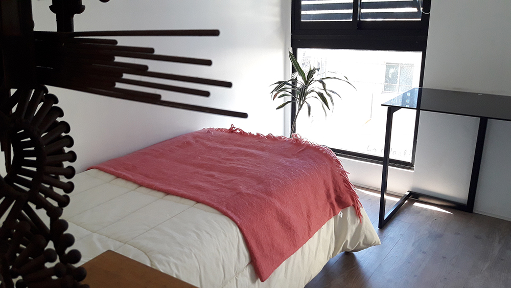 Interior y habitaciones de la residencial para estudiantes Casa Crisol en Concepción